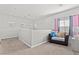 Bright loft area with seating, ample natural light, and carpeted floors at 9494 Alma Ridge Ave, Las Vegas, NV 89178