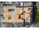 Aerial shot showing the layout of the property, which has ample parking, and some partially covered sections at 9865 Penny Ln, Las Vegas, NV 89178
