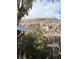 Tranquil backyard setting with natural vegetation and a picturesque mountain backdrop at 9865 Penny Ln, Las Vegas, NV 89178