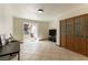 Bonus room featuring tile flooring, built-in wardrobe, and a sliding glass door to the back yard at 9865 Penny Ln, Las Vegas, NV 89178