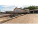 Home with stone accents has a two-car garage and a back yard patio at 9865 Penny Ln, Las Vegas, NV 89178
