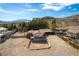 A home's exterior with desert landscaping under a clear blue sky at 9865 Penny Ln, Las Vegas, NV 89178