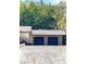 Spacious two-car garage providing ample parking and storage in a serene, natural setting at 9865 Penny Ln, Las Vegas, NV 89178