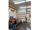 Well-lit garage featuring shelving, storage, and ample workspace for projects and hobbies at 9865 Penny Ln, Las Vegas, NV 89178