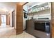 This laundry area features a Whirlpool washer and dryer and shelving for storage at 9865 Penny Ln, Las Vegas, NV 89178