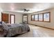 Spacious main bedroom featuring a king bed, large windows, and access to the outdoor area at 9865 Penny Ln, Las Vegas, NV 89178