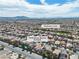 Wonderful aerial view of a community with a park, mountain views, and well-maintained homes at 1016 Echo Beach Ave, North Las Vegas, NV 89086