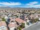 Aerial view of a community with desert landscape and mountain range in background at 1016 Echo Beach Ave, North Las Vegas, NV 89086