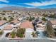 Aerial view of a neighborhood with mountain backdrop, houses with solar panels, and street parking at 1016 Echo Beach Ave, North Las Vegas, NV 89086