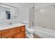 Bathroom featuring a shower-tub combo, standard toilet, and vanity with updated faucet at 1016 Echo Beach Ave, North Las Vegas, NV 89086