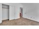 Bedroom features neutral walls and carpeted floor, closet, and ensuite bathroom access at 1016 Echo Beach Ave, North Las Vegas, NV 89086