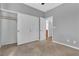 Carpeted bedroom with neutral walls, closet with sliding doors, and adjoining bathroom entrance at 1016 Echo Beach Ave, North Las Vegas, NV 89086