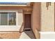 Close-up of the front door with a textured wall and decorative trim at 1016 Echo Beach Ave, North Las Vegas, NV 89086