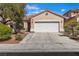 Inviting single-story home with desert landscaping and a two-car garage at 1016 Echo Beach Ave, North Las Vegas, NV 89086