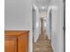 Hallway featuring tile flooring and doorways leading to various rooms at 1016 Echo Beach Ave, North Las Vegas, NV 89086