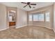 Main bedroom with a ceiling fan, tile floors, and an en-suite bathroom at 1016 Echo Beach Ave, North Las Vegas, NV 89086