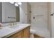 Well-lit bathroom with a modern vanity, sleek fixtures, and a combined tub and shower at 10452 Niagara Falls Ln, Las Vegas, NV 89144