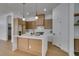Kitchen featuring island with breakfast bar and stainless steel appliances at 10452 Niagara Falls Ln, Las Vegas, NV 89144