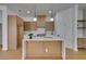 Bright kitchen with island, stainless appliances, and light wood cabinetry at 10452 Niagara Falls Ln, Las Vegas, NV 89144