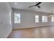 Bright living room with modern lighting, multiple windows, and light hardwood flooring at 10452 Niagara Falls Ln, Las Vegas, NV 89144