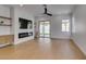 Bright living room features hardwood floors, a modern fireplace, and backyard access through sliding glass doors at 10452 Niagara Falls Ln, Las Vegas, NV 89144