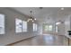 Spacious living room features large windows, hardwood floors, and a bright and open design at 10452 Niagara Falls Ln, Las Vegas, NV 89144