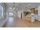 Open floor plan combining kitchen and living room area with modern design at 10452 Niagara Falls Ln, Las Vegas, NV 89144
