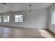 Spacious living room with bright natural light, recessed lighting, and wood flooring at 10452 Niagara Falls Ln, Las Vegas, NV 89144