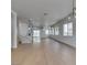 Open-concept living room showcasing natural light, recessed lighting, and seamless flow to the kitchen at 10452 Niagara Falls Ln, Las Vegas, NV 89144