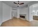Spacious main bedroom with hardwood floors, ensuite bathroom access, and a modern fireplace at 10452 Niagara Falls Ln, Las Vegas, NV 89144