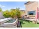 Backyard featuring a relaxing hot tub and an outdoor grill area, perfect for entertaining at 12245 Olivetta Ct, Las Vegas, NV 89138