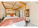 Bedroom with a four-poster bed, enhanced by neutral tones and a well-lit space at 12245 Olivetta Ct, Las Vegas, NV 89138