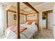 Comfortable bedroom featuring a four-poster bed with a warm, inviting ambiance at 12245 Olivetta Ct, Las Vegas, NV 89138