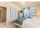 Comfortable bedroom with neutral walls, carpet flooring, natural light, and a quaint dresser at 12245 Olivetta Ct, Las Vegas, NV 89138