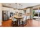 Bright, modern kitchen with granite countertops, stainless steel appliances, and a center island with seating at 12245 Olivetta Ct, Las Vegas, NV 89138