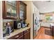 Well-equipped kitchen with stainless steel refrigerator, granite countertops, and ample cabinet space at 12245 Olivetta Ct, Las Vegas, NV 89138