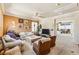 Cozy living room with comfortable seating, a ceiling fan, and access to a balcony with scenic views at 12245 Olivetta Ct, Las Vegas, NV 89138