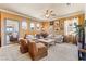 Inviting living room with ample natural light, comfortable sofas, and a cozy atmosphere at 12245 Olivetta Ct, Las Vegas, NV 89138
