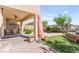 Inviting outdoor patio area with brick pavers, plush seating, and manicured landscaping perfect for entertaining at 12245 Olivetta Ct, Las Vegas, NV 89138