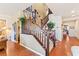 Inviting staircase with wood railings and carpeted steps, leading to the upper level of the home at 12245 Olivetta Ct, Las Vegas, NV 89138