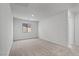 Comfortable bedroom with neutral carpet, white walls, and a window at 1701 Desert Path Ave, North Las Vegas, NV 89032