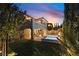 Backyard featuring a pool, covered patio, and elegant landscaping, perfect for enjoying summer evenings at 193 Elder View Dr, Las Vegas, NV 89138