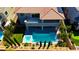 Inviting backyard features a pool, hot tub, covered dining, and immaculate landscaping at 193 Elder View Dr, Las Vegas, NV 89138