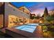 Backyard featuring a pool, covered patio, and elegant landscaping, perfect for enjoying summer evenings at 193 Elder View Dr, Las Vegas, NV 89138