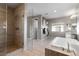 Modern bathroom with a glass shower, soaking tub, and dual sink vanity at 193 Elder View Dr, Las Vegas, NV 89138