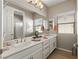 Bright bathroom featuring double sinks, ample counter space, and modern fixtures at 193 Elder View Dr, Las Vegas, NV 89138