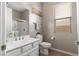 Well-lit bathroom with a white vanity, framed mirror, and tiled shower at 193 Elder View Dr, Las Vegas, NV 89138