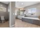 Bright bathroom featuring a soaking tub with mosaic tile and ample counter space at 193 Elder View Dr, Las Vegas, NV 89138