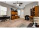Comfortable carpeted room featuring built-in shelving and a ceiling fan for added comfort at 193 Elder View Dr, Las Vegas, NV 89138