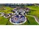 Aerial view of a community park with playground, walking paths, and plenty of green space for recreation at 193 Elder View Dr, Las Vegas, NV 89138